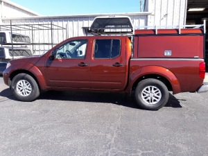 Nissan Frontier ARE DCU aluminum work truck topper